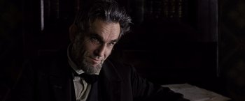 Movie still from “Lincoln” (2012), directed by Steven Spielberg – A man with a beard and a suit and tie; Close Up shot, Low angle