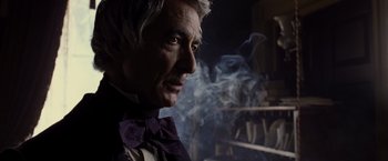 Movie still from “Lincoln” (2012), directed by Steven Spielberg – An older man wearing a purple bow tie; Close Up shot, Over the shoulder angle
