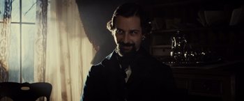 Movie still from “Lincoln” (2012), directed by Steven Spielberg – A man in a suit and tie in a dark room; Close Up shot, Over the shoulder angle