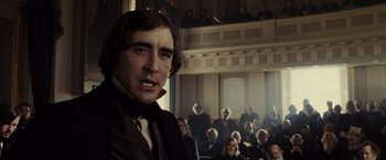 Movie still from “Lincoln” (2012), directed by Steven Spielberg – A man standing in front of a crowd of people; Close Up shot, Low angle