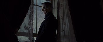 Movie still from “Lincoln” (2012), directed by Steven Spielberg – A man standing in front of a window; Medium shot, Low angle