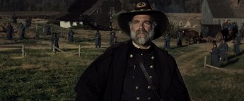 Movie still from “Lincoln” (2012), directed by Steven Spielberg – An old man in a civil war era uniform; Medium shot, Over the shoulder angle