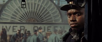 Movie still from “Lincoln” (2012), directed by Steven Spielberg – A man wearing a hat standing in front of a crowd; Close Up shot, Low angle