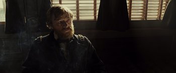 Movie still from “Lincoln” (2012), directed by Steven Spielberg – A man sitting in a room with a beard; Close Up shot, Over the shoulder angle