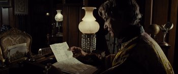 Movie still from “Lincoln” (2012), directed by Steven Spielberg – An older woman looking at an old handwritten letter; Close Up shot, Over the shoulder angle