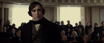 Movie still from “Lincoln” (2012), directed by Steven Spielberg – A man standing in front of a group of people; Medium shot, Over the shoulder angle