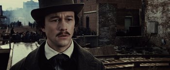 Movie still from “Lincoln” (2012), directed by Steven Spielberg – A man with a mustache wearing a top hat; Close Up shot, Low angle