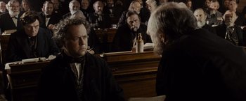 Movie still from “Lincoln” (2012), directed by Steven Spielberg – A group of people sitting in a courtroom; Medium shot, Over the shoulder angle