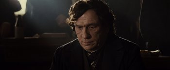Movie still from “Lincoln” (2012), directed by Steven Spielberg – A person wearing a suit and tie; Close Up shot, Low angle