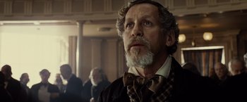 Movie still from “Lincoln” (2012), directed by Steven Spielberg – An old man with a beard and a bow tie; Close Up shot, Low angle