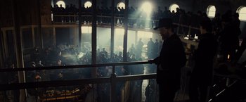 Movie still from “Lincoln” (2012), directed by Steven Spielberg – A crowd of people standing in a room; Wide shot, Over the shoulder angle