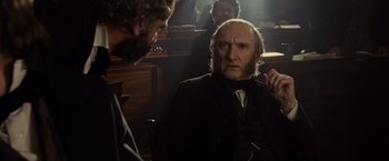 Movie still from “Lincoln” (2012), directed by Steven Spielberg – A man in a suit and a beard talking to another man in a suit and a beard; Close Up shot, Over the shoulder angle