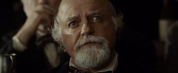Movie still from “Lincoln” (2012), directed by Steven Spielberg – An older man with a beard and a mustache; Close Up shot, Low angle