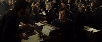 Movie still from “Lincoln” (2012), directed by Steven Spielberg – A group of people sitting at a table; Medium shot, High angle