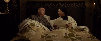 Movie still from “Lincoln” (2012), directed by Steven Spielberg – An older man and a younger woman in a bed; Medium shot, High angle