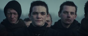 Movie still from “Macbeth” (2015), directed by Justin Kurzel – A young man is looking into the distance; Close Up shot, Low angle