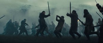 Movie still from “Macbeth” (2015), directed by Justin Kurzel – A group of people are fighting in the fog; Wide shot, Low angle