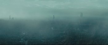 Movie still from “Macbeth” (2015), directed by Justin Kurzel – A person standing in the middle of a field in the fog; Extreme Wide shot, High angle