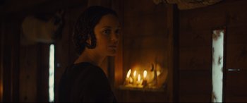 Movie still from “Macbeth” (2015), directed by Justin Kurzel – A woman standing in front of a fire place; Close Up shot, Over the shoulder angle
