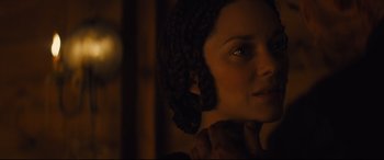 Movie still from “Macbeth” (2015), directed by Justin Kurzel – A person wearing a hat and looking to the side; Close Up shot, Over the shoulder angle