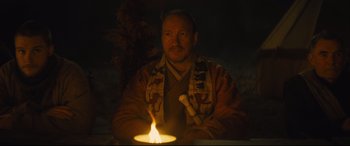 Movie still from “Macbeth” (2015), directed by Justin Kurzel – A man with a candle in his hand; Medium shot, Low angle