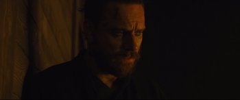 Movie still from “Macbeth” (2015), directed by Justin Kurzel – A person wearing a black shirt; Close Up shot, Over the shoulder angle