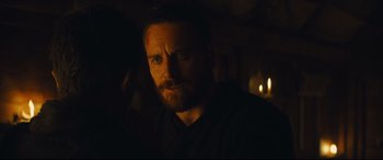 Movie still from “Macbeth” (2015), directed by Justin Kurzel – A person in a dark room; Close Up shot, Over the shoulder angle