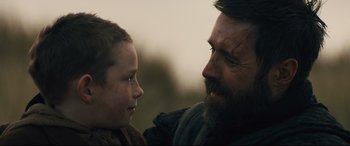 Movie still from “Macbeth” (2015), directed by Justin Kurzel – A man and a boy looking at one another; Close Up shot, Over the shoulder angle