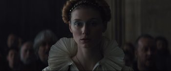 Movie still from “Macbeth” (2015), directed by Justin Kurzel – A person wearing a white shirt; Close Up shot, Low angle