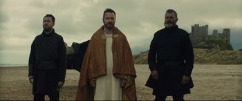 Movie still from “Macbeth” (2015), directed by Justin Kurzel – A man in a robe standing next to another man in a robe; Medium shot, Low angle