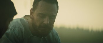 Movie still from “Macbeth” (2015), directed by Justin Kurzel – A person with a beard looking down; Close Up shot, Low angle