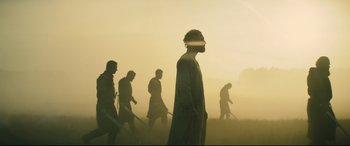 Movie still from “Macbeth” (2015), directed by Justin Kurzel – A group of men walking through a field with swords; Wide shot, Low angle
