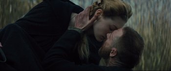 Movie still from “Macbeth” (2015), directed by Justin Kurzel – A man and a woman are kissing in the dark; Close Up shot, Over the shoulder angle