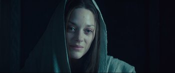 Movie still from “Macbeth” (2015), directed by Justin Kurzel – A person wearing a hooded sweatshirt; Close Up shot, Low angle