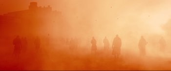 Movie still from “Macbeth” (2015), directed by Justin Kurzel – A group of people walking through a dust storm; Extreme Wide shot, High angle