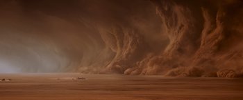 Movie still from “Mad Max: Fury Road” (2015), directed by George Miller – A large dust storm in the middle of the desert; Extreme Wide shot, High angle
