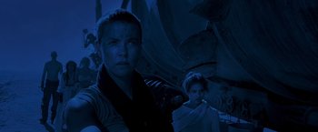 Movie still from “Mad Max: Fury Road” (2015), directed by George Miller – A woman and a man standing next to each other in the dark; Medium shot, Low angle