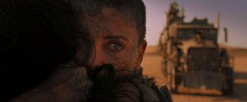 Movie still from “Mad Max: Fury Road” (2015), directed by George Miller – A person with a beard and a face covered in dirt; Close Up shot, Low angle