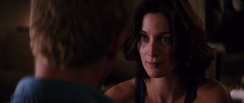 Movie still from “Memento” (2000), directed by Christopher Nolan – A person looking at the camera; Close Up shot, Over the shoulder angle