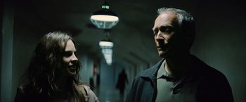 Movie still from “Million Dollar Baby” (2004), directed by Clint Eastwood – A man and a woman standing next to each other in a hallway; Close Up shot, Over the shoulder angle