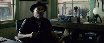 Movie still from “Million Dollar Baby” (2004), directed by Clint Eastwood – An older man sitting in front of an antique typewriter; Close Up shot, Over the shoulder angle