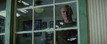 Movie still from “Million Dollar Baby” (2004), directed by Clint Eastwood – An older man looking out of a window; Close Up shot, Low angle