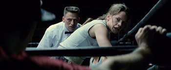 Movie still from “Million Dollar Baby” (2004), directed by Clint Eastwood – A man and a woman are looking at each other; Close Up shot, Low angle