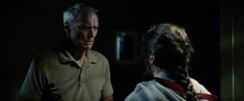Movie still from “Million Dollar Baby” (2004), directed by Clint Eastwood – An older man and a young girl in a room; Close Up shot, Over the shoulder angle
