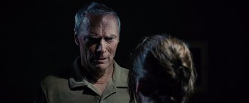 Movie still from “Million Dollar Baby” (2004), directed by Clint Eastwood – An older man is looking at a younger woman; Close Up shot, Over the shoulder angle