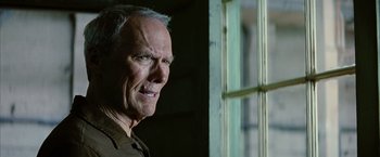 Movie still from “Million Dollar Baby” (2004), directed by Clint Eastwood – An older man standing in front of a window; Close Up shot, Low angle