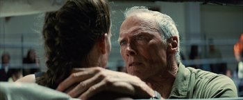 Movie still from “Million Dollar Baby” (2004), directed by Clint Eastwood – An older man looking at a younger woman in a mirror; Close Up shot, Low angle