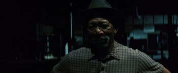 Movie still from “Million Dollar Baby” (2004), directed by Clint Eastwood – An older man wearing a hat and a plaid shirt; Close Up shot, Low angle