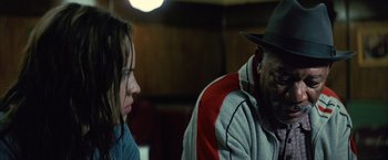 Movie still from “Million Dollar Baby” (2004), directed by Clint Eastwood – A man and a woman sitting next to each other in a room; Close Up shot, Over the shoulder angle