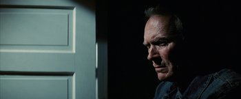 Movie still from “Million Dollar Baby” (2004), directed by Clint Eastwood – A person looking at the camera; Close Up shot, Low angle